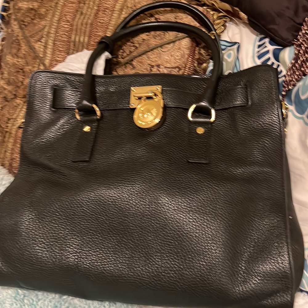 Michael Kor’s black leather with gold hardware never used leather satchel